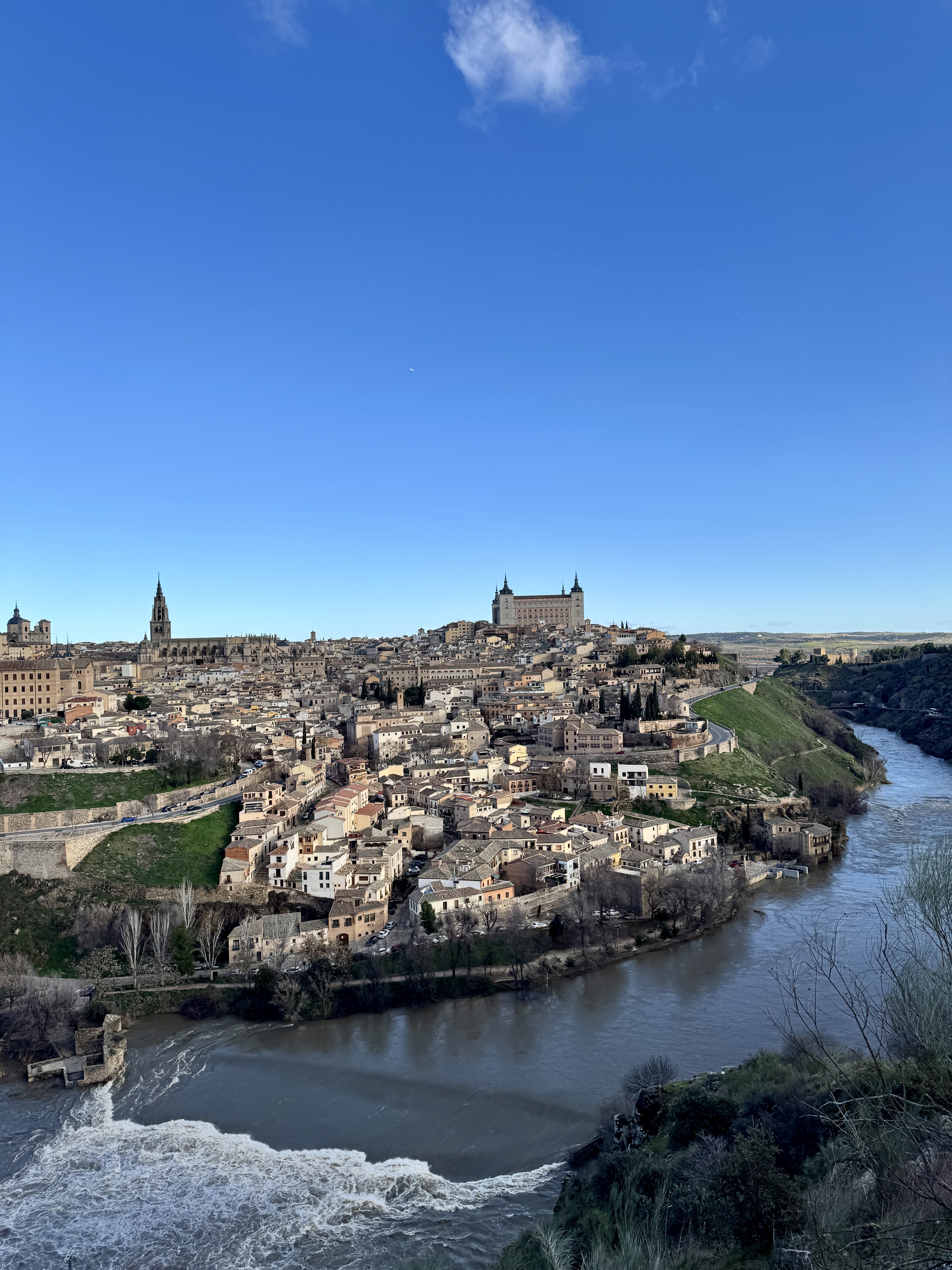 Evening light on a quiet residential street with parked bicycles.