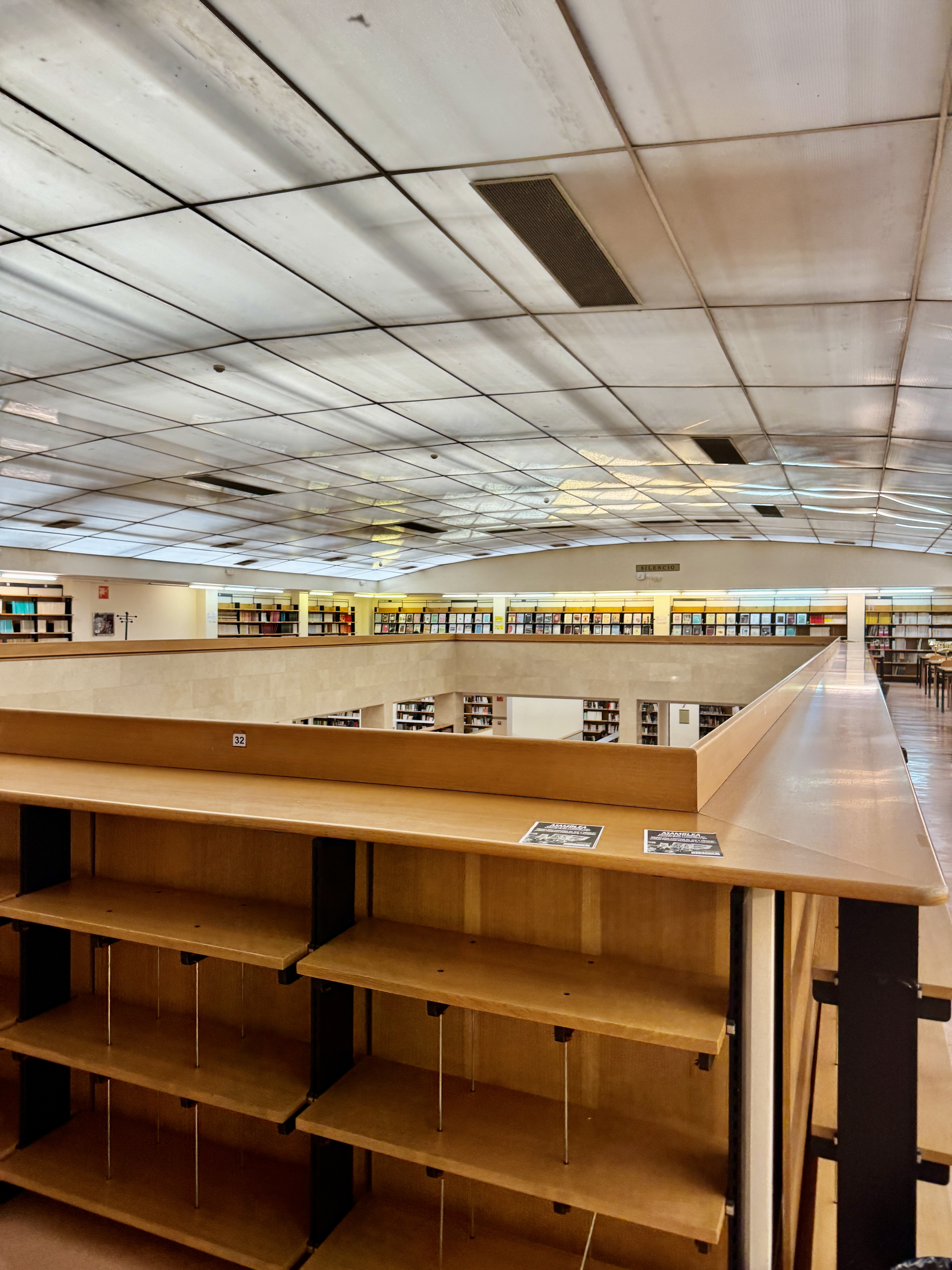 Sunrise over the Manzanares River with modern bridges in the background.