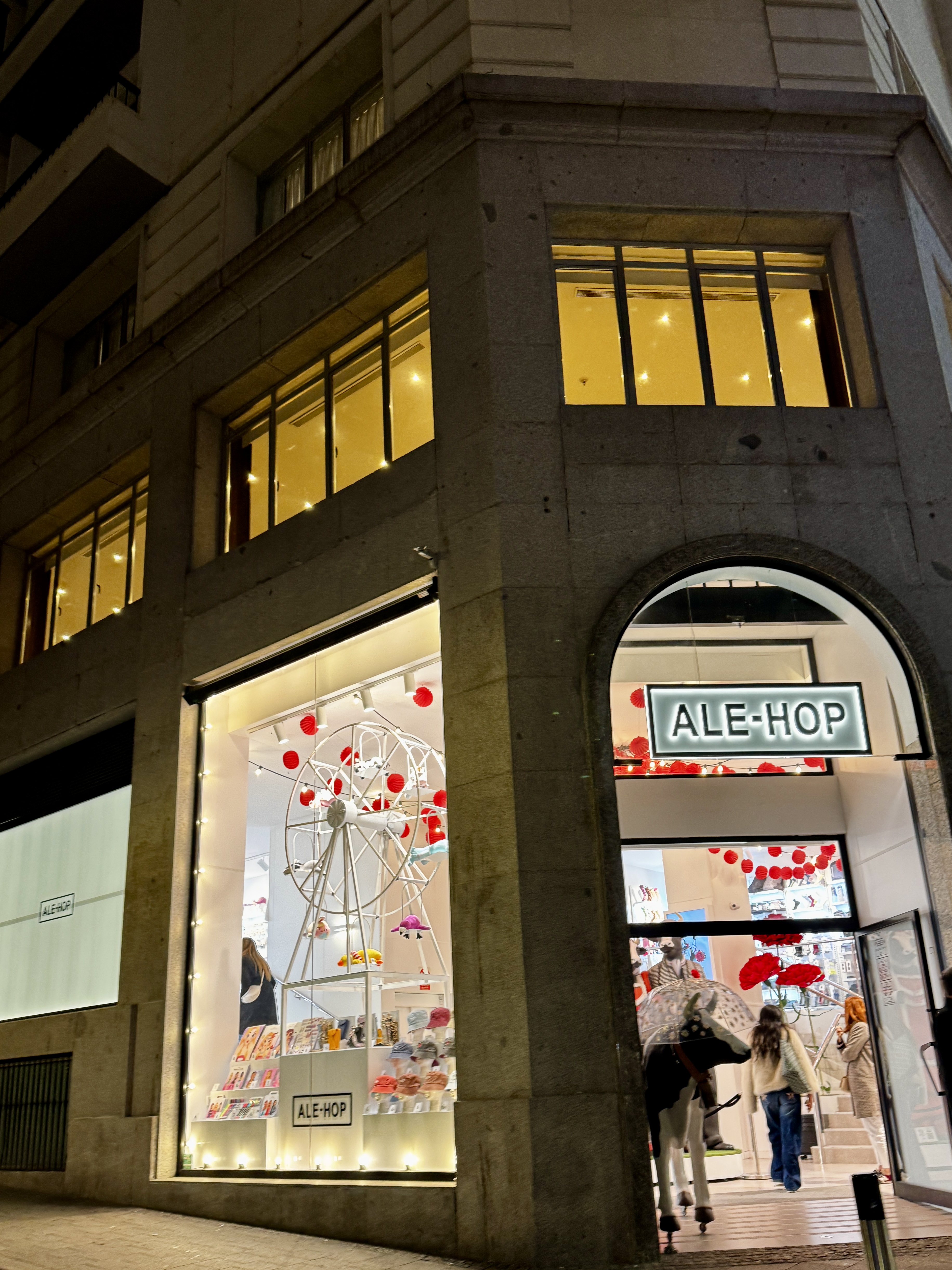 Theatre marquees and billboards glowing in the evening.