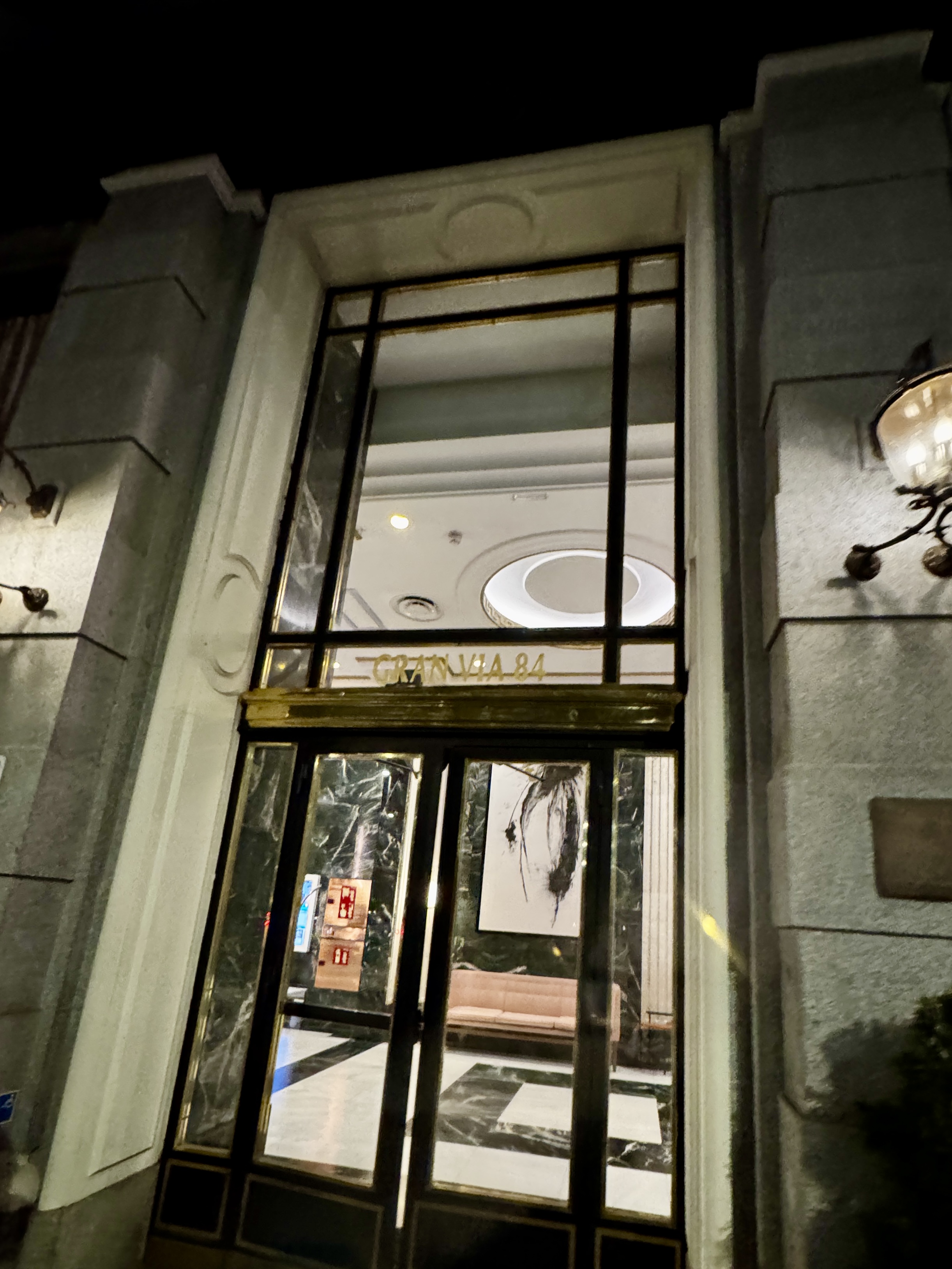 Night view of the Puerta del Sol with digital screens.
