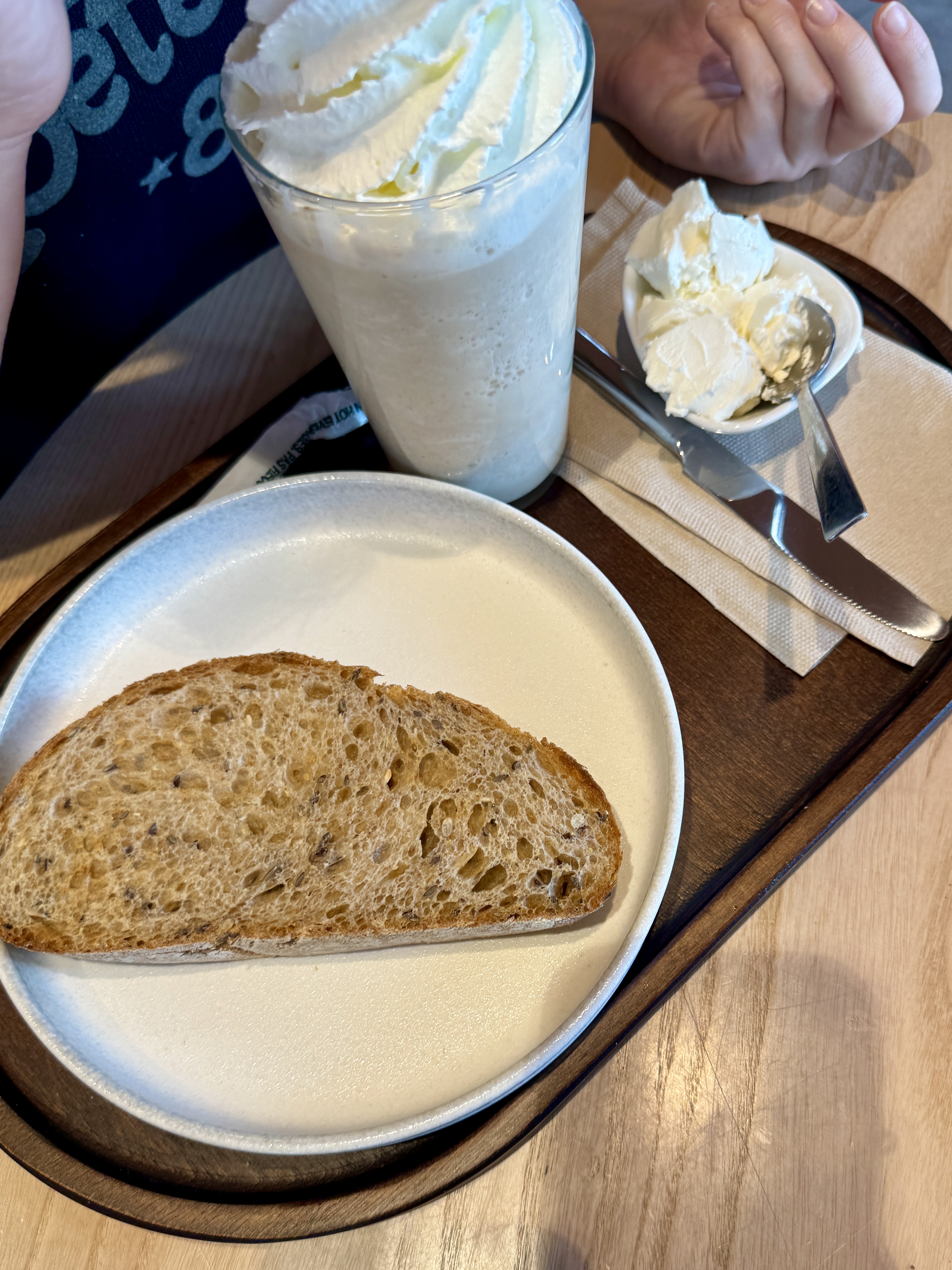 Madrid's flag waving against a clear blue sky.