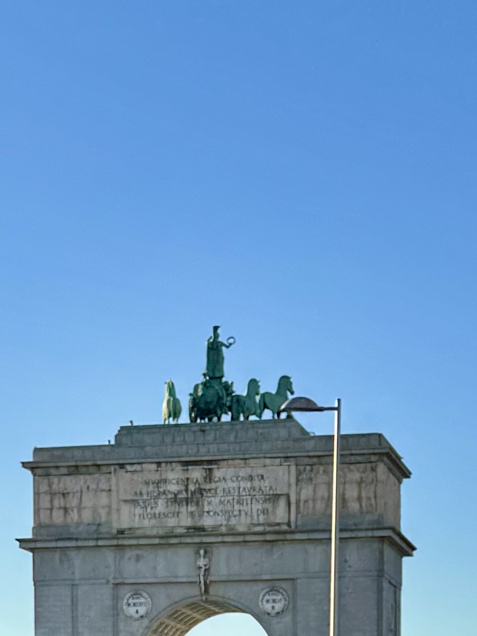 Outdoor café tables with people enjoying tapas and conversation.