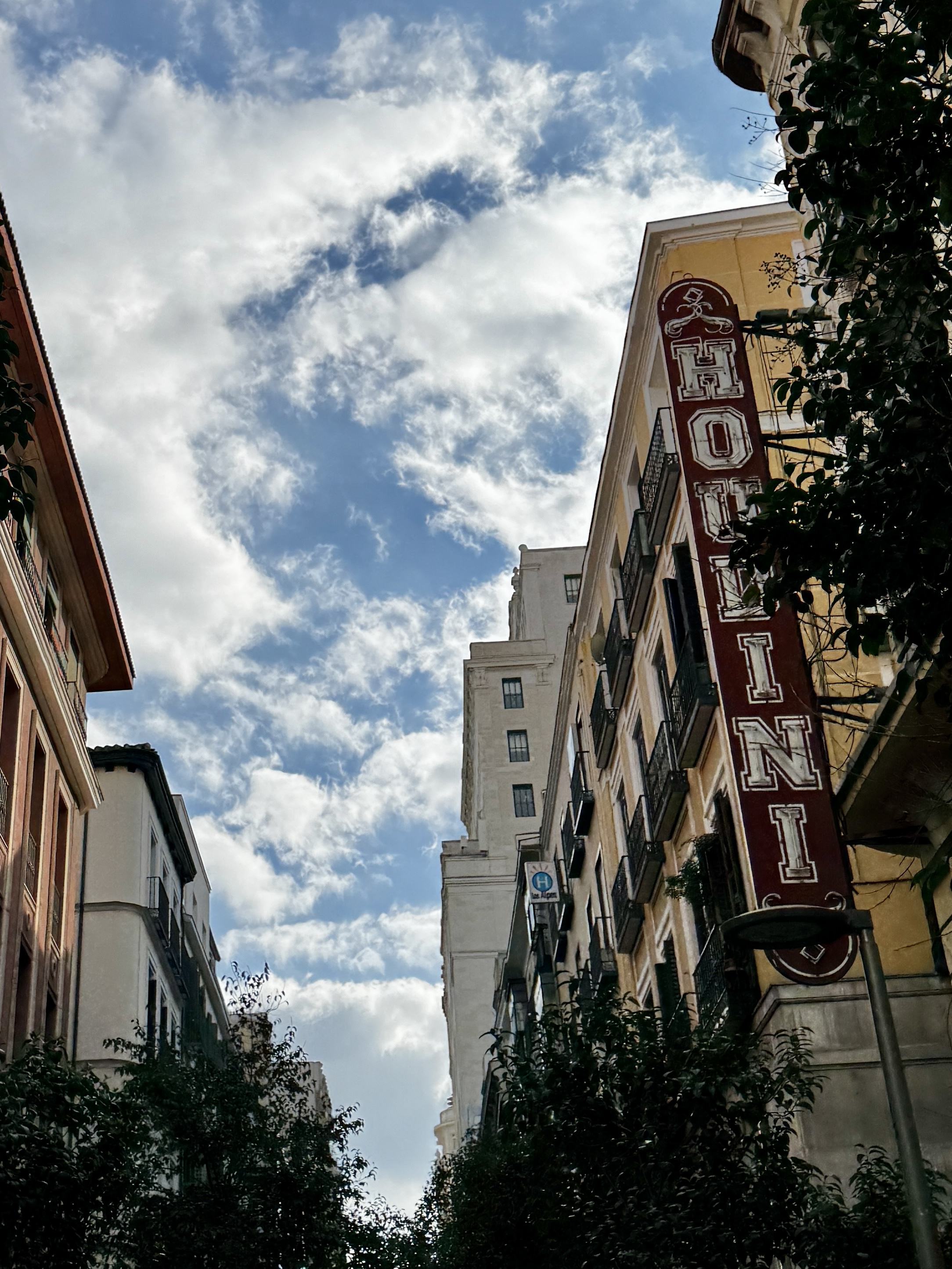 Rain-slicked streets reflecting neon signs and traffic lights.