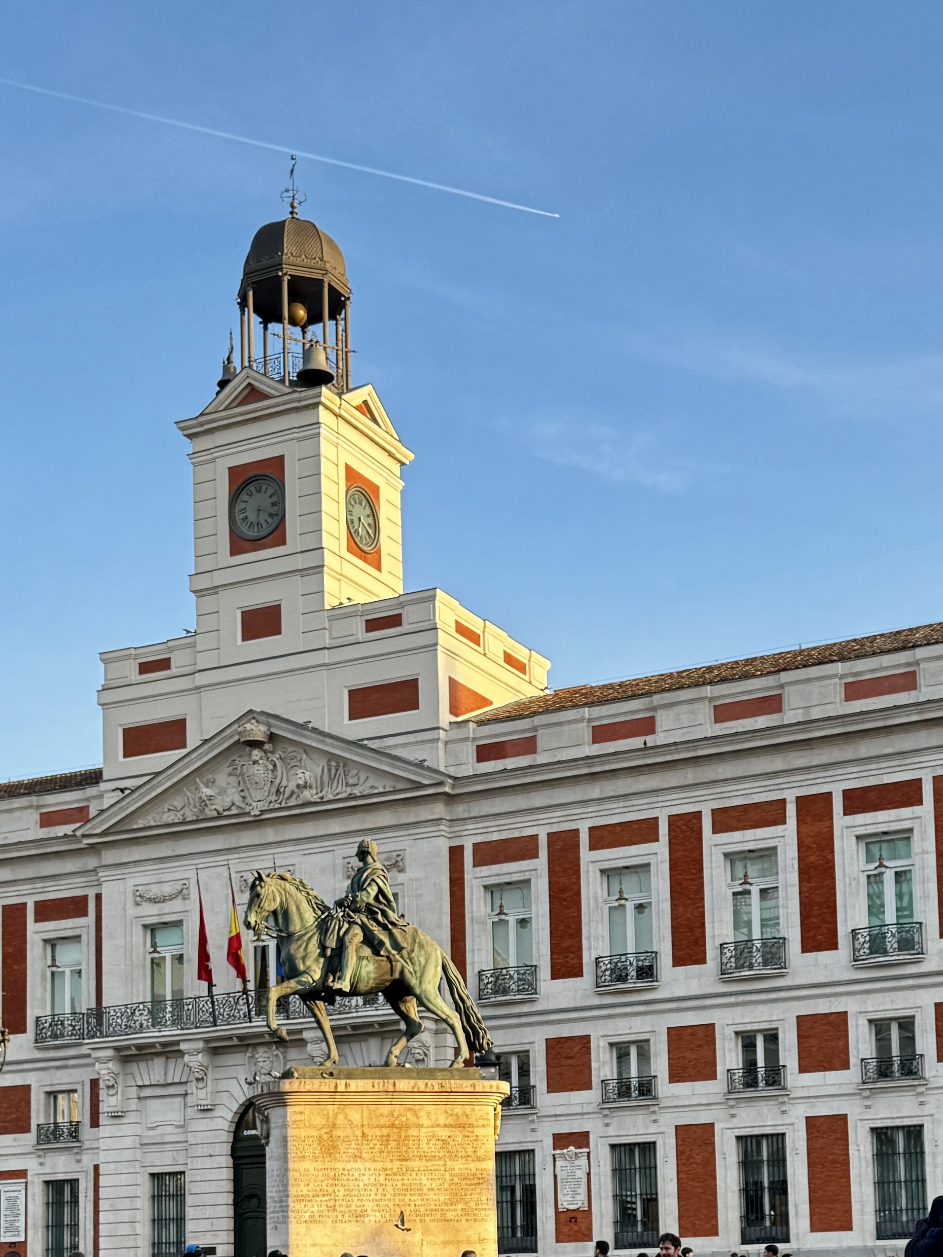 Reflections of historic architecture in rain puddles.